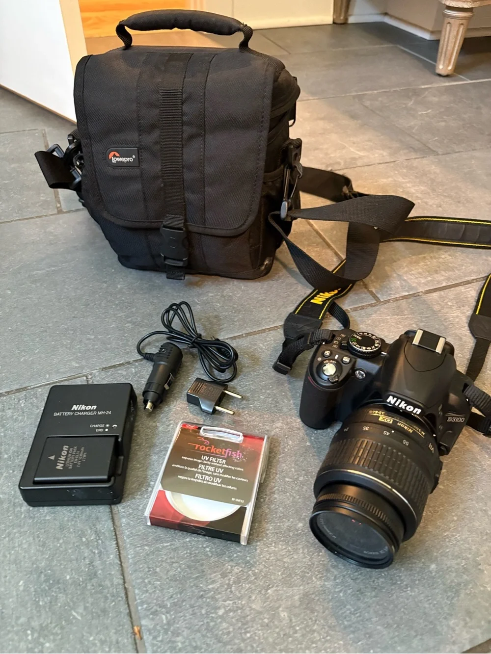 Nikon Black DSLR Camera with Black Lens and Gold Accents